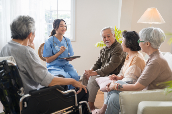 Nurse with seniors in group home