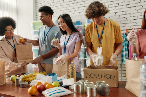 Group of people preparing donation and food bags